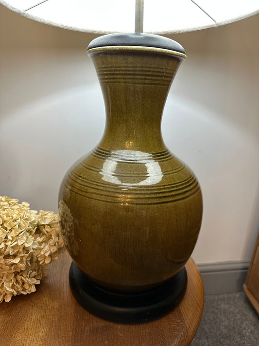 Large olive green antique lamp in the form of a ginger jar