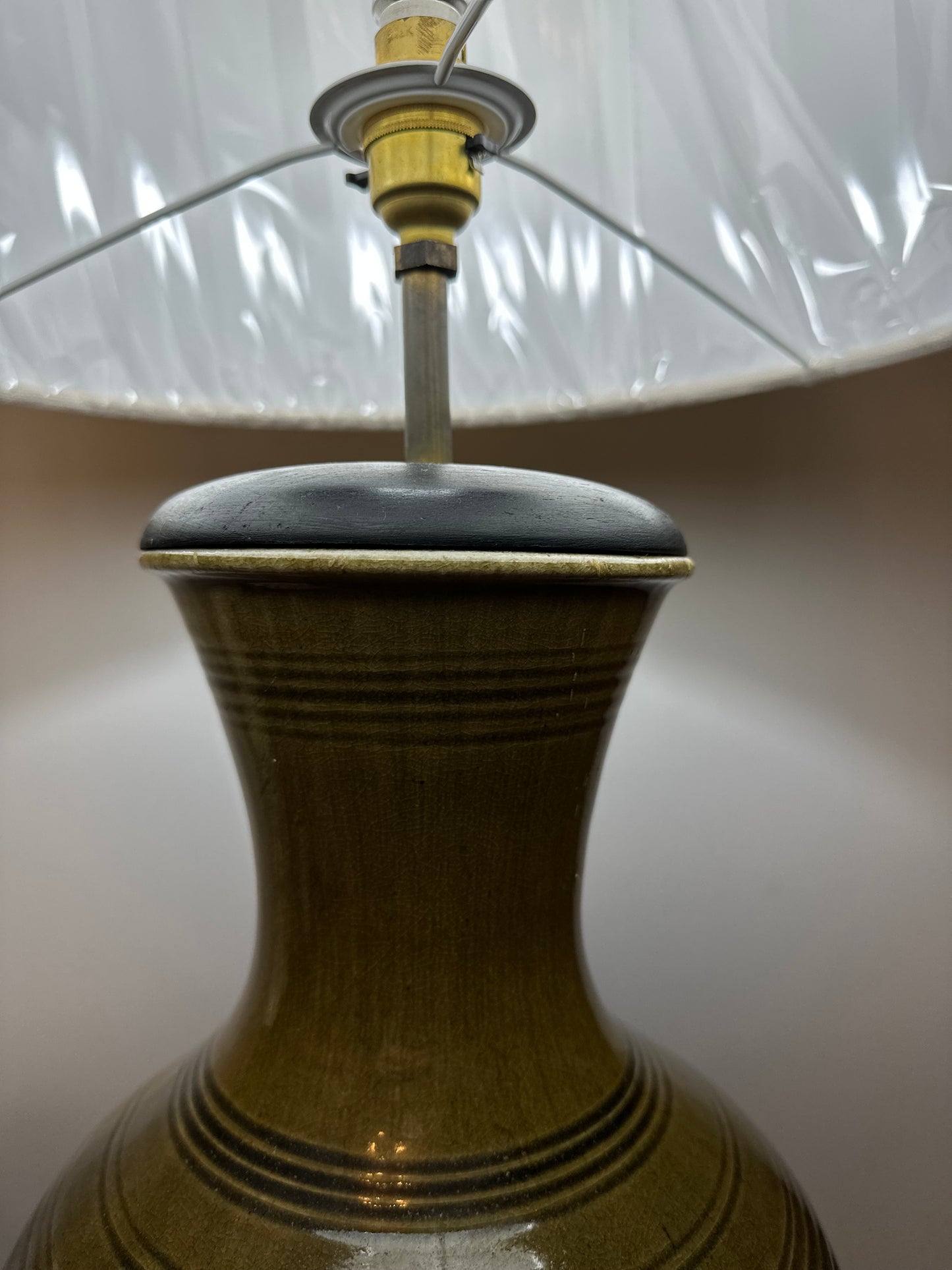 Large olive green antique lamp in the form of a ginger jar